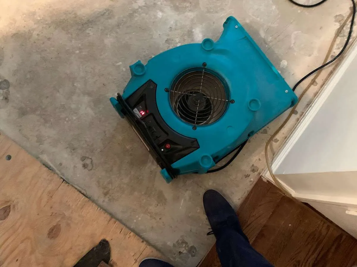 Air mover drying subfloor during Leak Detection & Repair in South Euclid